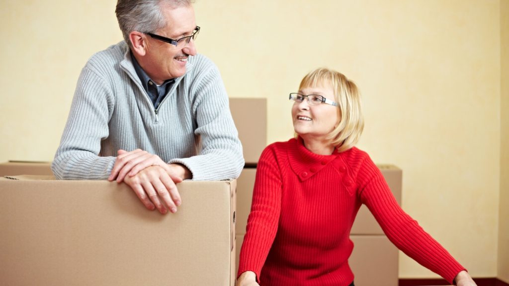 happy senior couple smile moving package